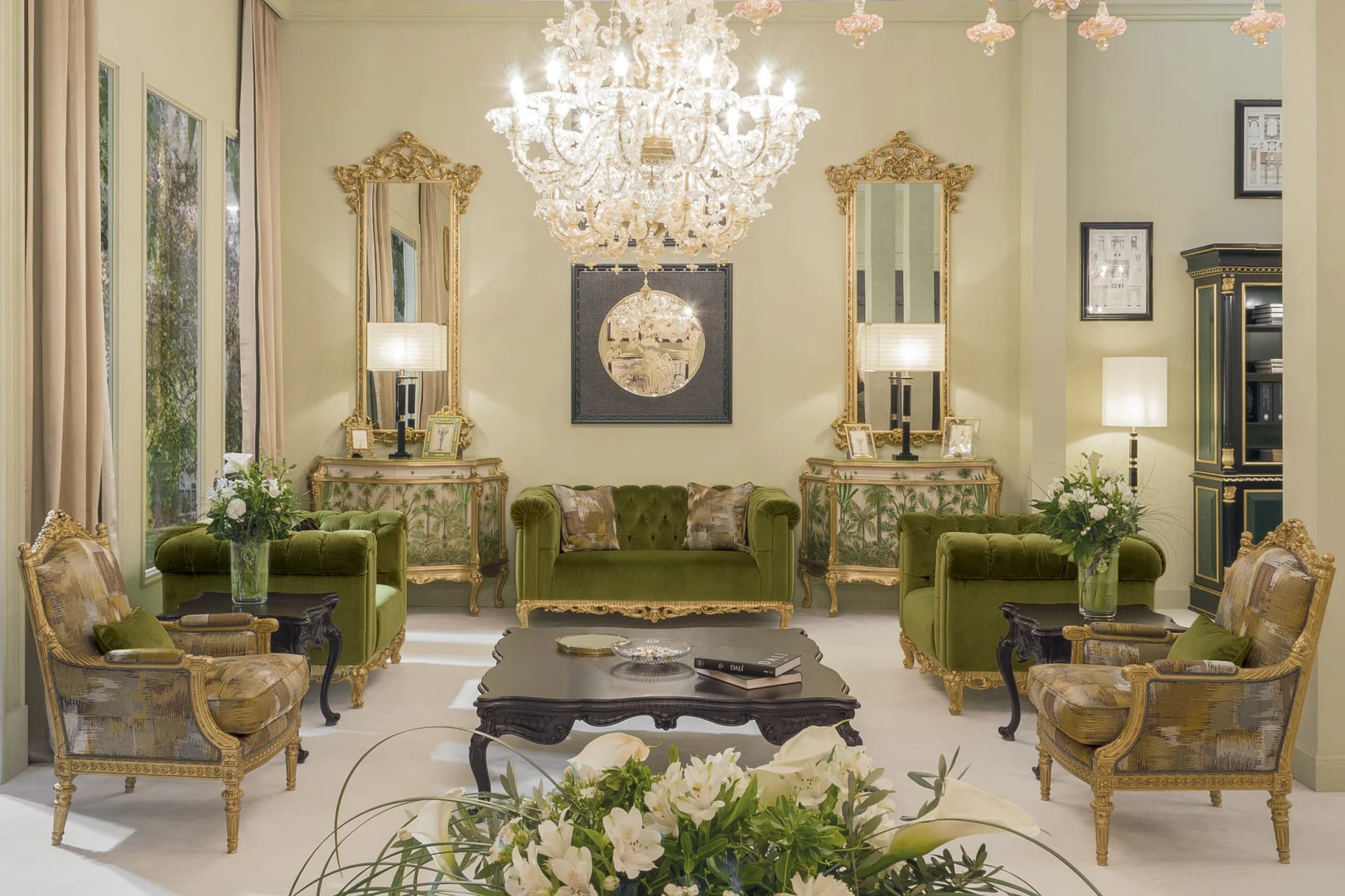 Salon of a classic Italian palazzo furnished by Fratelli Radice, with gilded mirror and console table, bordeaux damask walls and herringbone parquet